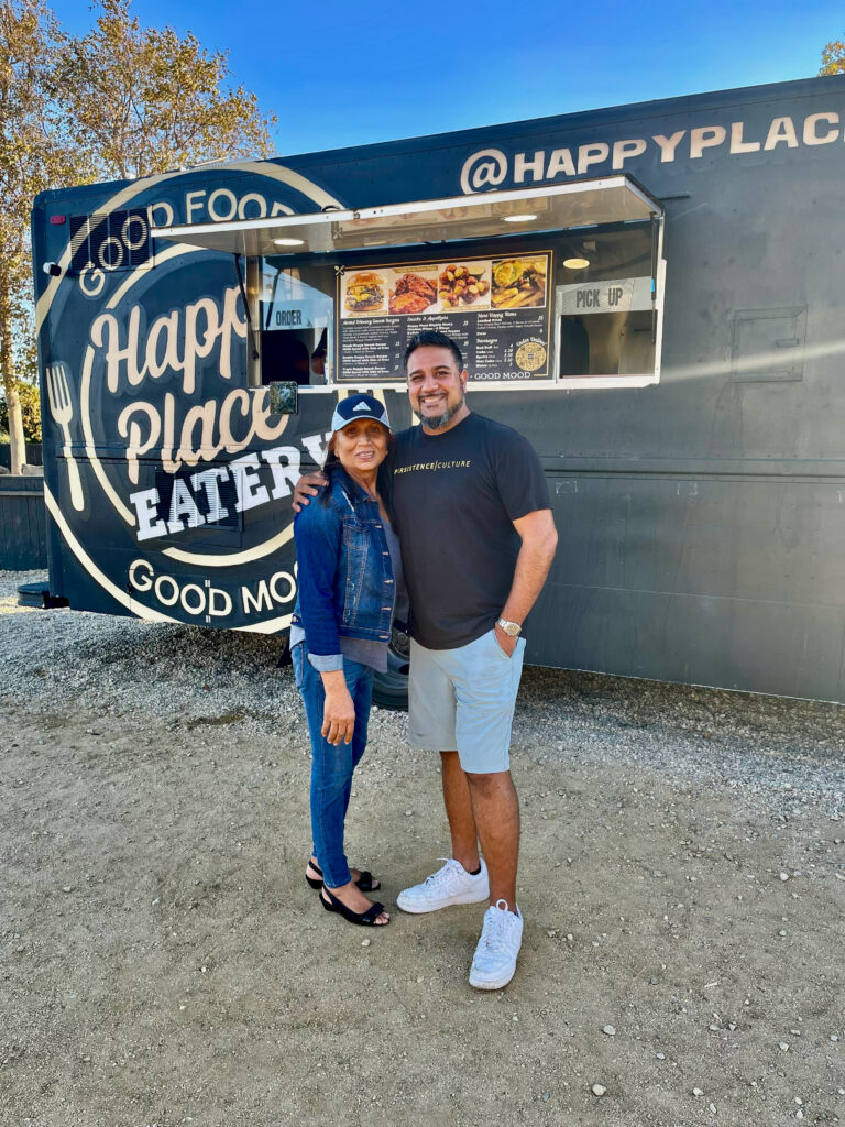 Happy and her son Sky Sunner, founder of Happy Place Eatery, outside the Happy Place food truck in Ventura